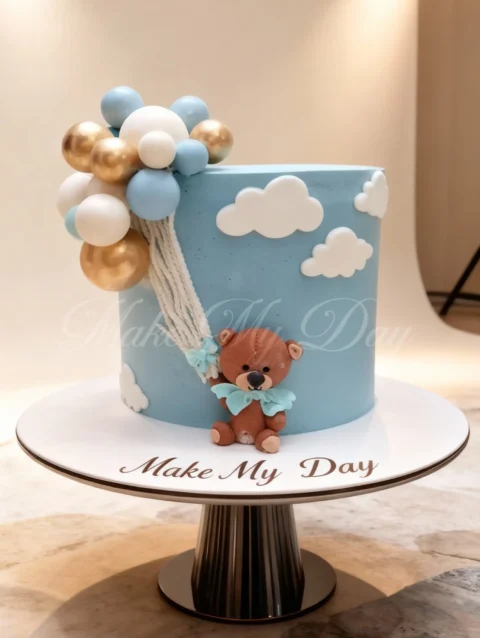 Baby birthday cake design with teddy theme and pastel colors