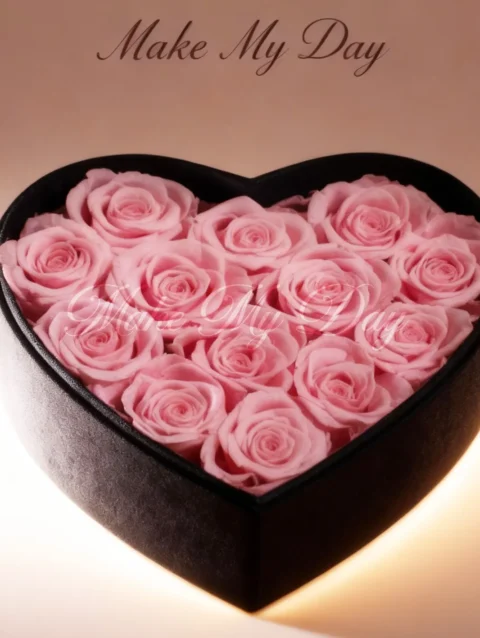 Heart shaped box filled with pink real roses
