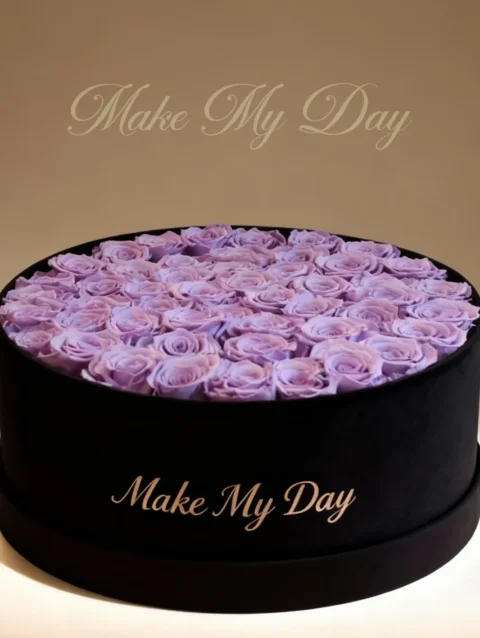 Premium floral arrangement in round black box